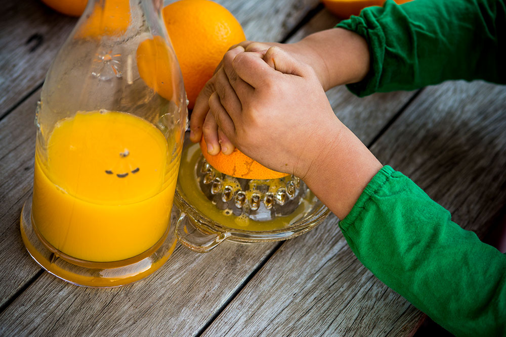 Orange being juiced