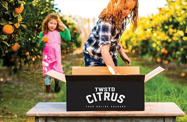 Children with boxes of fruit