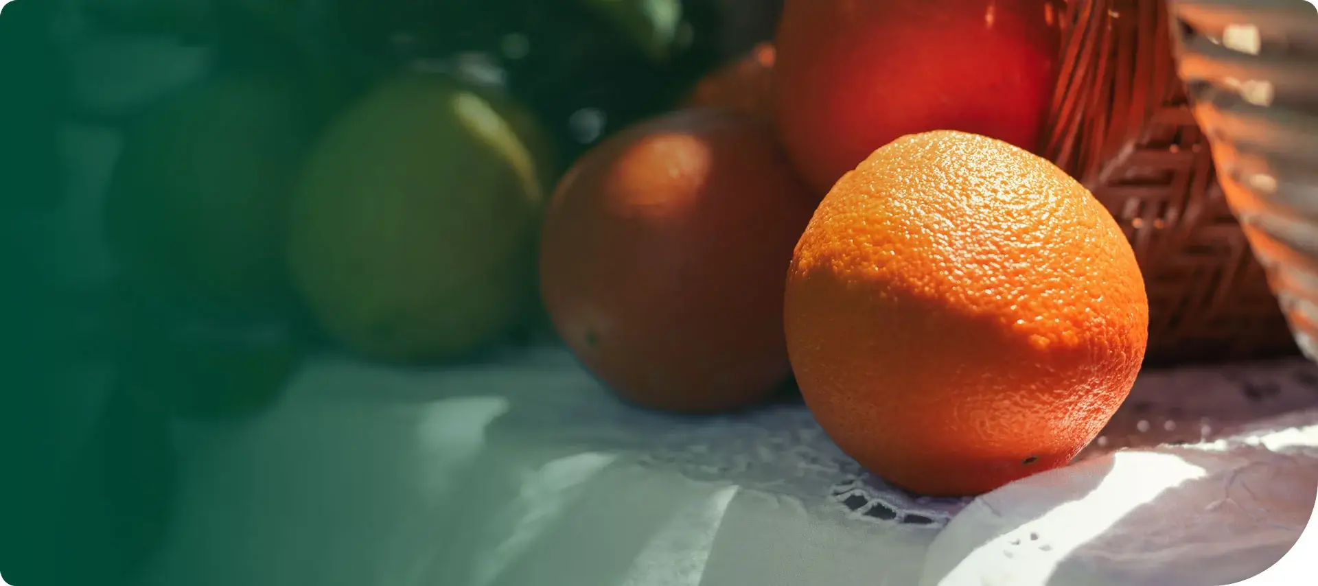 Close up shot of a spilled basket of oranges